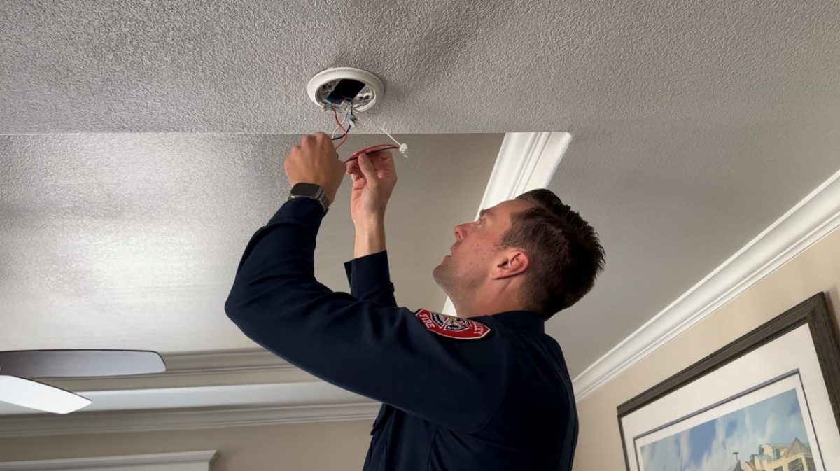 CVFD Firefighter Installing Smoke Alarm