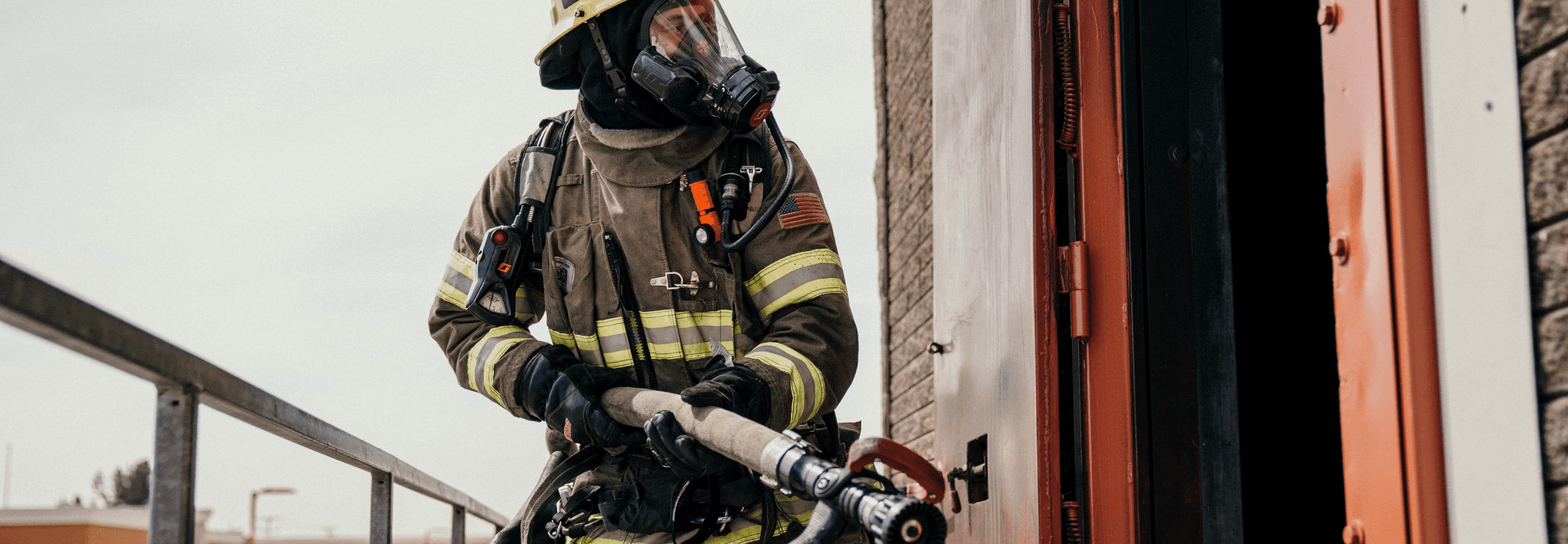 A Chino Valley Firefighter Prepares to Enter the Burn Tower with a Hose